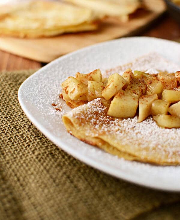 Apple pie crepes stuffed with vanilla yogurt crepe filling and topped with apple pie filling