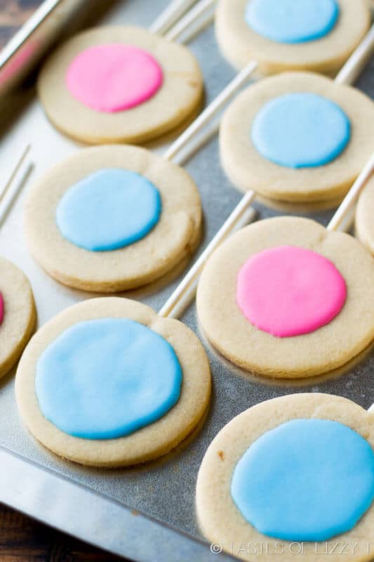 A simple decorated sugar cookie recipe is the star of the party with these Gender Reveal Cookies! Will it be pink or blue?