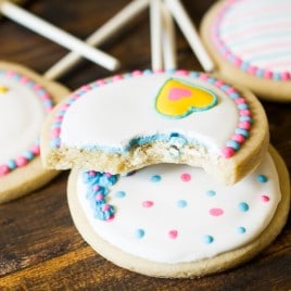 A simple decorated sugar cookie recipe is the star of the party with these Gender Reveal Cookies! Will it be pink or blue?
