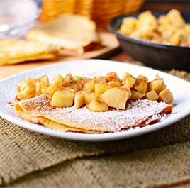 Whole wheat apple pie crepes stuffed with vanilla yogurt and topped with apple pie filling.