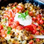 Top golden brown potatoes with your favorite taco ingredients for gluten free skillet Mexican potatoes the family will love!