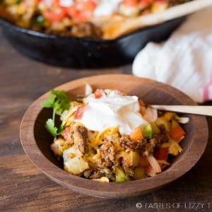 golden brown skillet Mexican potatoes topped with sour cream