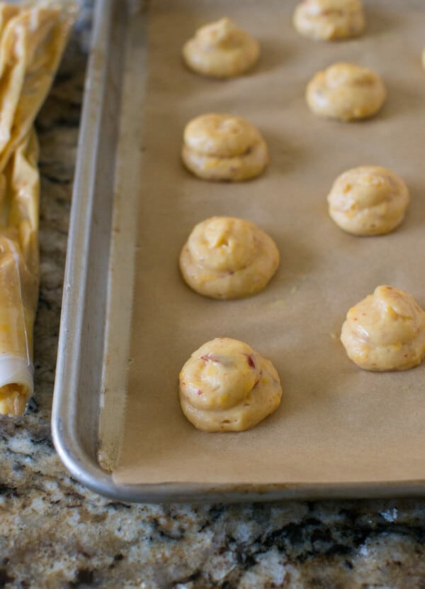 Chipotle Cheddar Gourgeres with Chipotle Lime Dipping Sauce: Crispy gougere puffs flavored with chipotle and cheddar served with a cool cilantro lime dip. A great party appetizer!