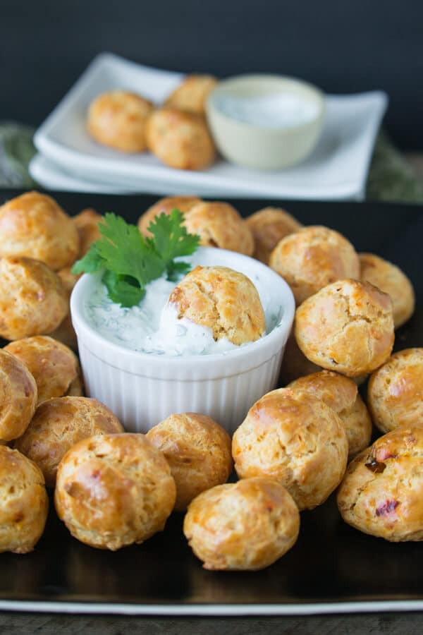 Chipotle Cheddar Gourgeres with Chipotle Lime Dipping Sauce: Crispy gougere puffs flavored with chipotle and cheddar served with a cool cilantro lime dip. A great party appetizer!