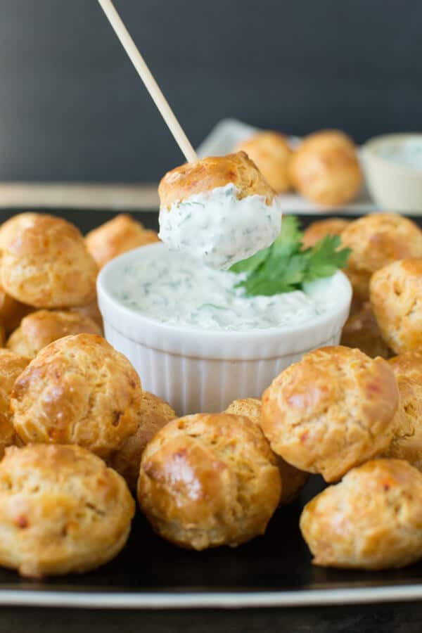 Chipotle Cheddar Gourgeres with Chipotle Lime Dipping Sauce: Crispy gougere puffs flavored with chipotle and cheddar served with a cool cilantro lime dip. A great party appetizer!