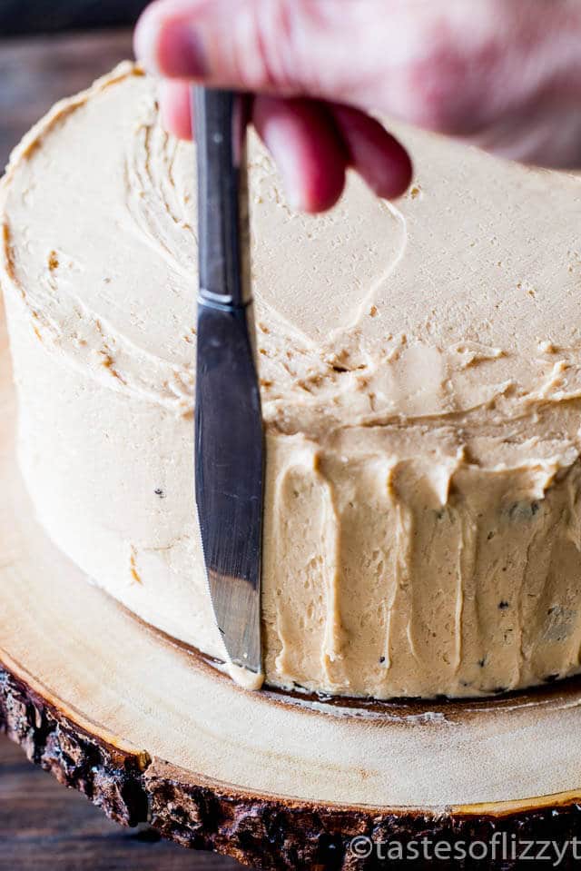 Chocolate cake layered with peanut butter frosting and chopped peanut butter Snickers bars make this Snickers cake a must for all chocolate peanut butter lovers.