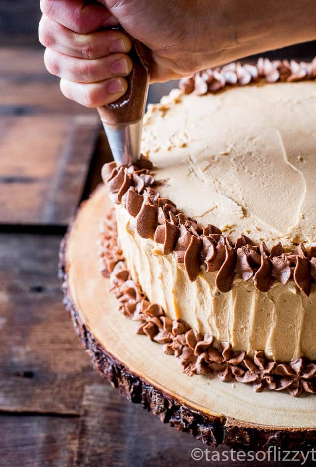 Chocolate cake layered with peanut butter frosting and chopped peanut butter Snickers bars make this Snickers cake a must for all chocolate peanut butter lovers.