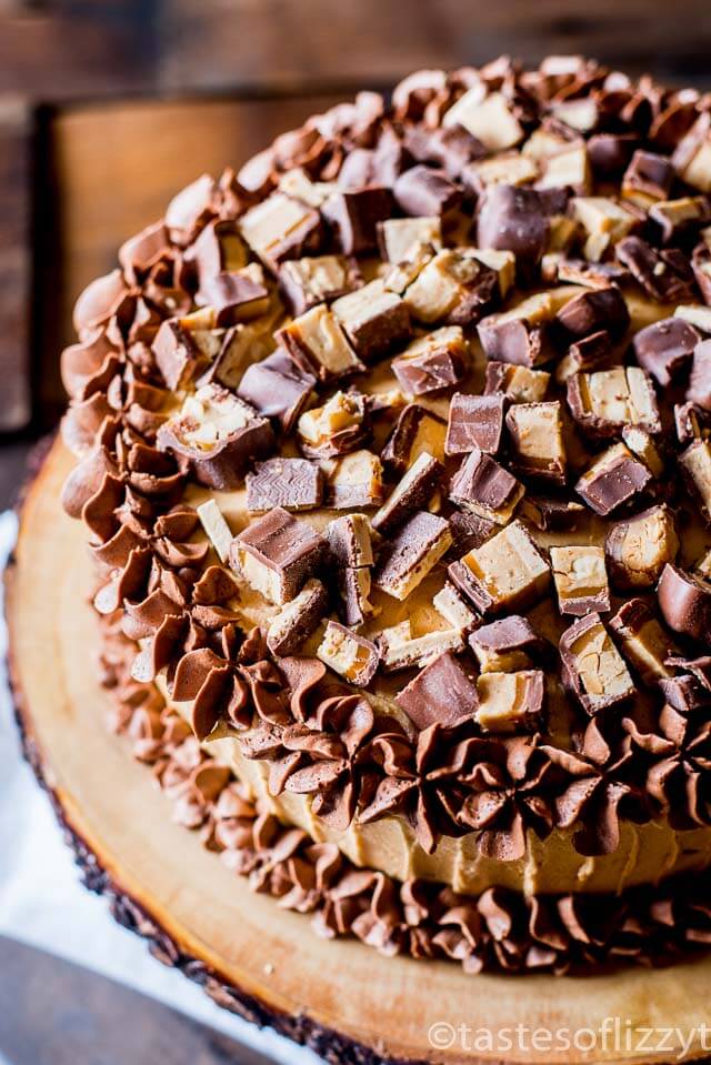 Chocolate cake layered with peanut butter frosting and chopped peanut butter Snickers bars make this Snickers cake a must for all chocolate peanut butter lovers.