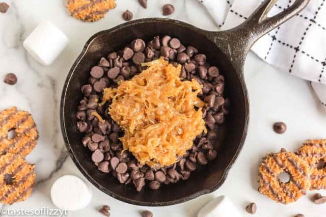 caramel coconut over chocolate chips in a skillet