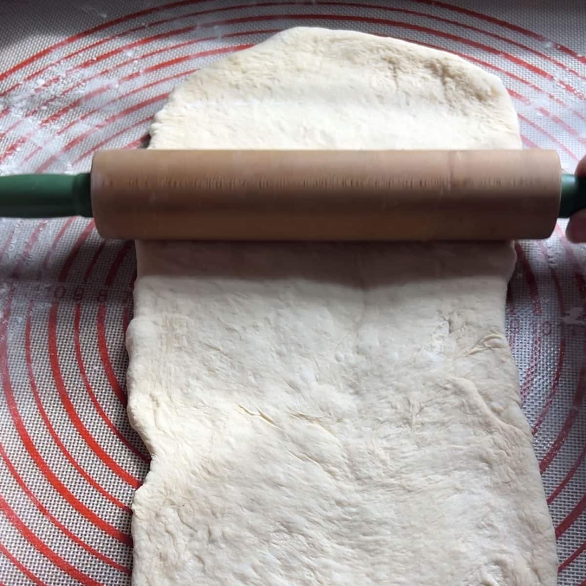 a rolling pin rolling out dough