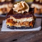 a reese's butterfinger cheesecake bar on a table