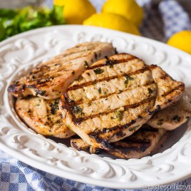 juicy grilled pork chops on a serving plate