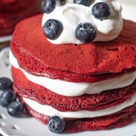 stack of red velvet pancakes with blueberries