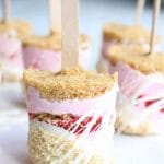Who says popsicles are for kids? These raspberry cheesecake greek yogurt popsicles are full of raspberries, graham cracker crumble and white chocolate.