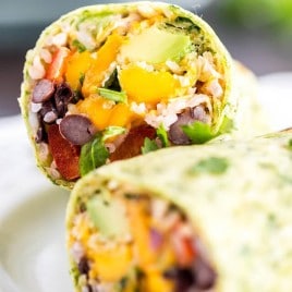 Vegetarian Burritos with beans, rice, chipotle chili sauce and mango avocado salsa, all wrapped in a homemade spinach tortilla! Easy dinner idea for summer!