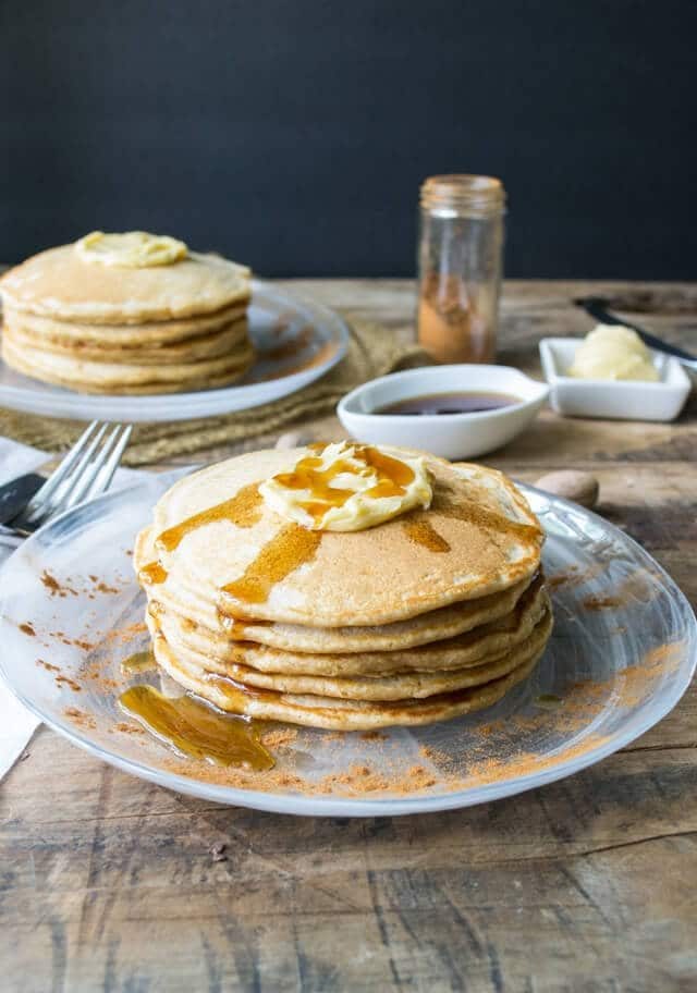 Whole wheat cinnamon pancakes that are light and fluffy. Maple butter makes the perfect topping for this fall breakfast!