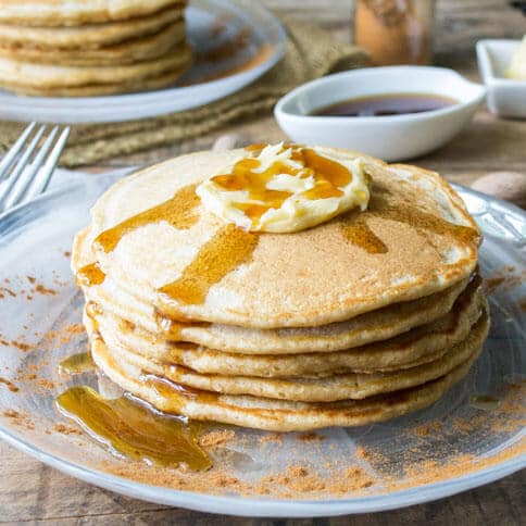 Whole wheat cinnamon pancakes that are light and fluffy. Maple butter makes the perfect topping for this fall breakfast!