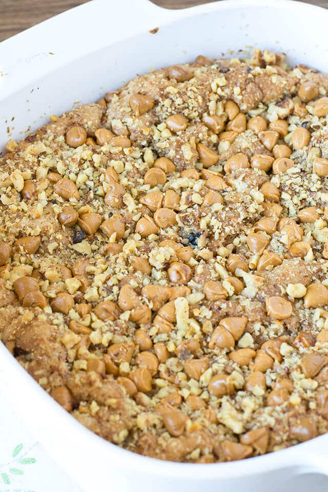 baking dish full of homemade apple cake with butterscotch chips