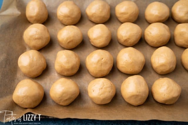 peanut butter balls on parchment paper