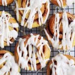 Pumpkin spice cinnamon buns are so pillowy soft and pair perfectly with the gooey spiced dark brown sugar filling. Drizzled with maple butter cream cheese frosting.