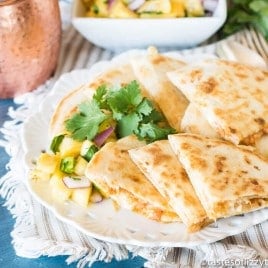 Sweet & spicy salmon quesadillas with rice, salmon and cheese warmed between golden brown tortillas. Serve alongside fresh pineapple salsa for a quick lunch solution.