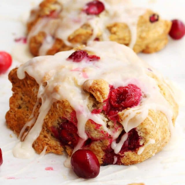 glazed cranberry scone on parchment paper