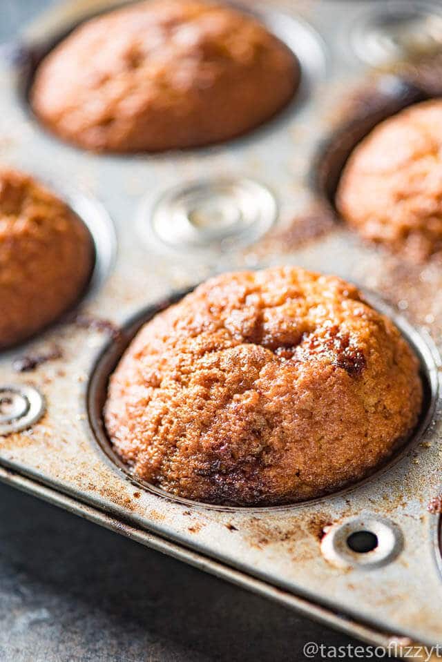 close up of cinnamon muffin in a muffin pan