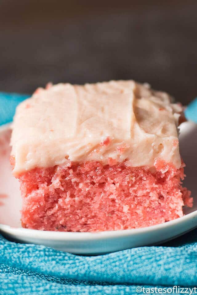 a piece of strawberry cake sitting on a plate