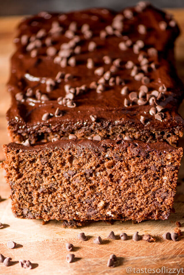 A close up of a piece of chocolate cake with a slices cut