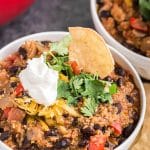 bowl of black bean chicken chili with toppings