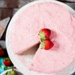 strawberry cake with a slice missing