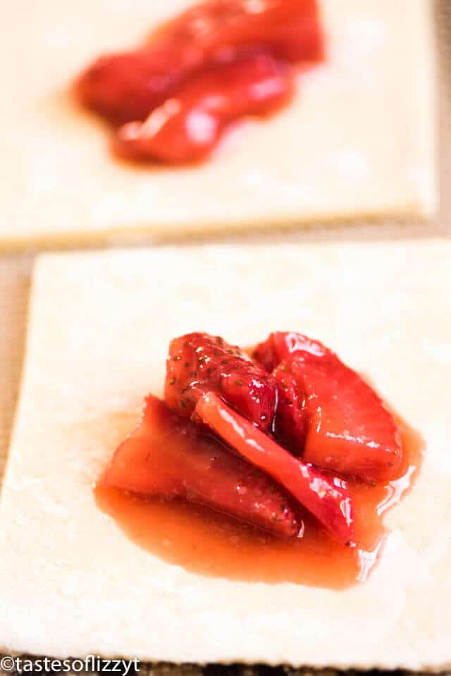 Quick and easy strawberry turnovers made with puff pastry and stuffed with fresh strawberry filling. Drizzle with glaze for a beautiful spring brunch recipe.