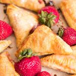 Quick and easy strawberry turnovers made with puff pastry and stuffed with fresh strawberry filling. Drizzle with glaze for a beautiful spring brunch recipe.