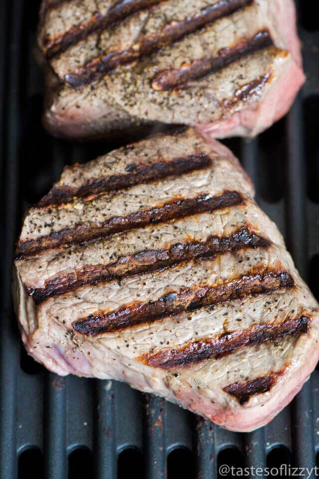 You've never had a steak like this! A homemade savory seasoned butter makes this Garlic Butter Steak melt in your mouth. Tips for grilling the best steak.