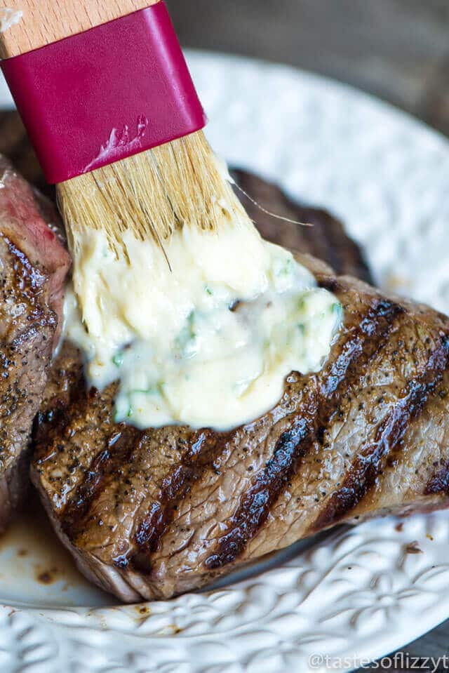 You've never had a steak like this! A homemade savory seasoned butter makes this Garlic Butter Steak melt in your mouth. Tips for grilling the best steak.