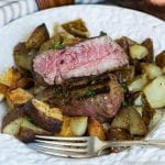 A close up of a plate of food, with Steak and potatoes