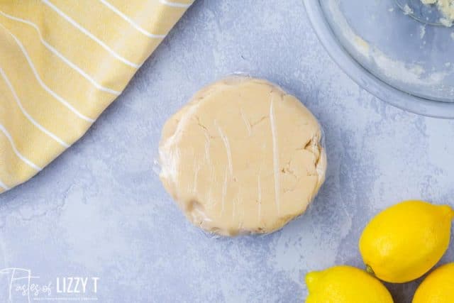 lemon sugar cookie dough wrapped in plastic wrap