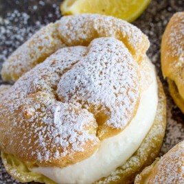 Light and delicious these Lemon Cream Puffs are baked until puffy and filled with a light lemon cream filling! A perfect addition to your dessert line!