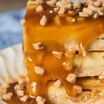 Looking for an easy dessert recipe for a potluck? Try these praline cheesecake bars with toffee bits and a shortbread crust. They're perfect on their own or with a scoop of ice cream drizzled with caramel.