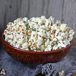 A bowl of food, with Popcorn