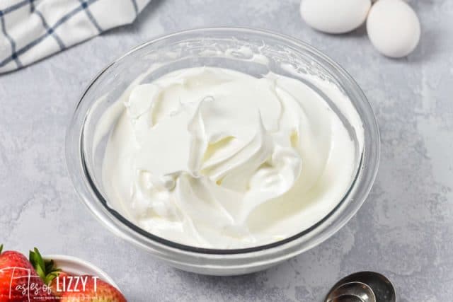 frothed egg whites in a mixing bowl