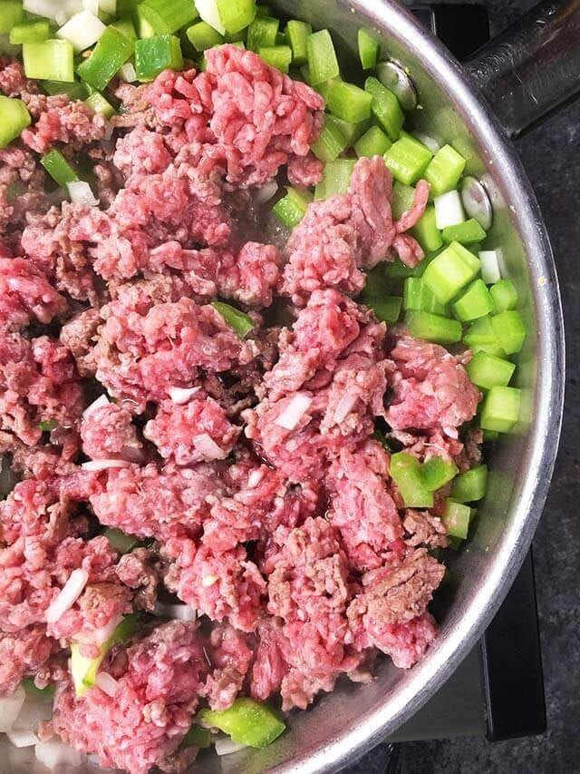 ground beef and green peppers in a skillet