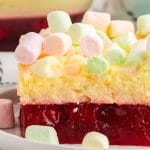 a closeup of cherry pineapple marshmallow jello salad on a plate
