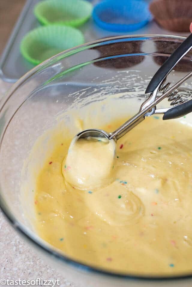 Use an ice cream scoop to scoop cake batter into cupcake tins. Solar System Cupcakes