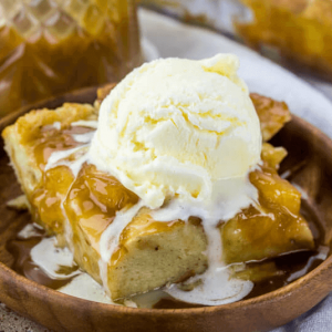 caramel apple bread pudding topped with vanilla ice cream