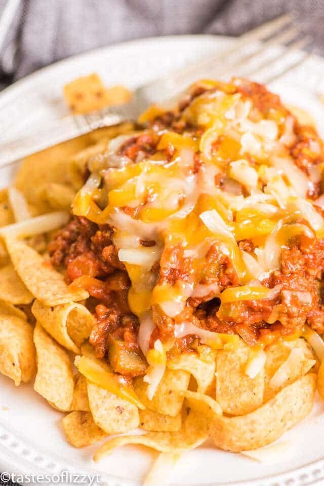 A close up of frito chili pie with cheese