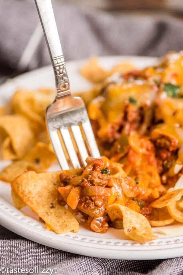 frito chili pie on a plate with a fork