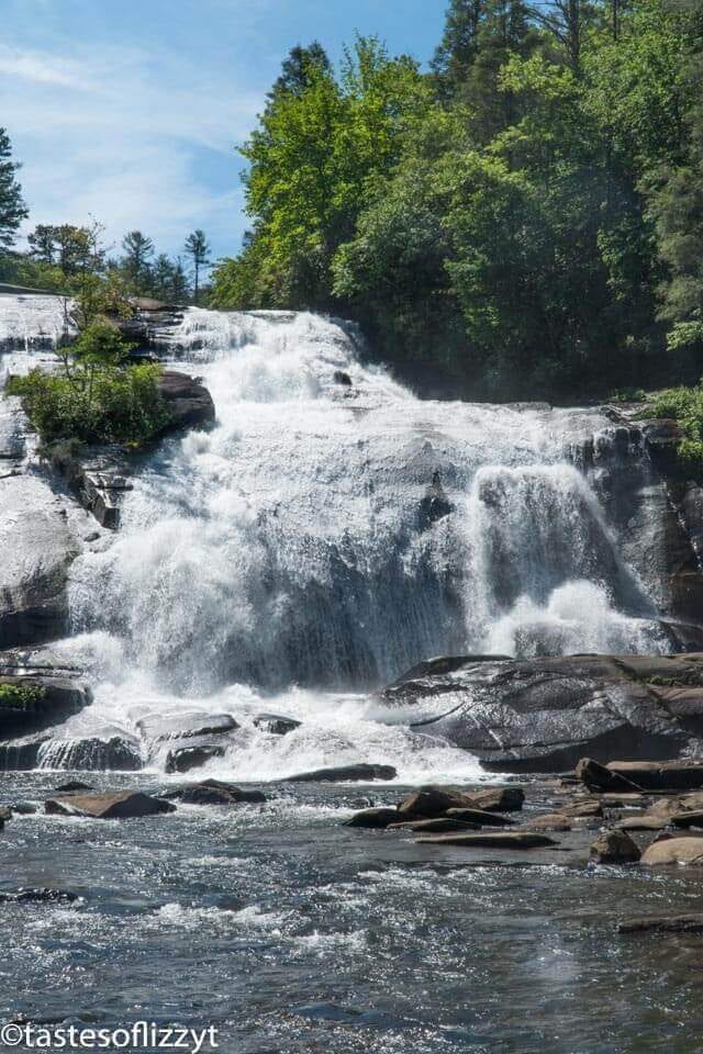 A large waterfall coming out of rocks