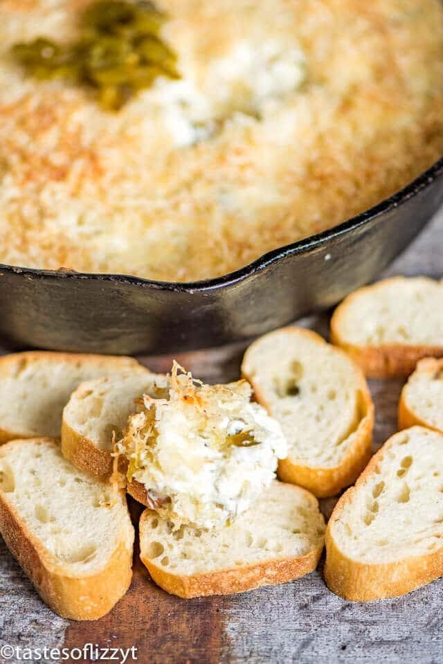jalapeno popper dip in a skillet with bread