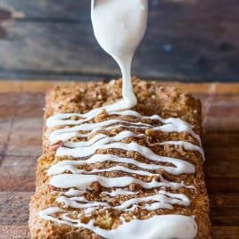 spoon drizzling glaze over bread